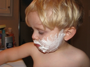 young boy shaving