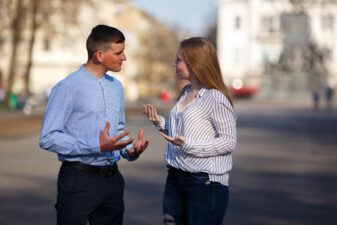 Young couple arguing outdoors