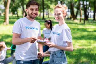 man and woman volunteering together