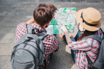 man and woman looking at a map together