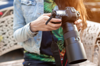 closeup of woman holding a camera