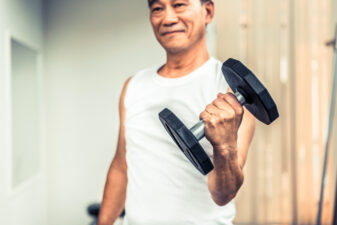 senior man lifting weights