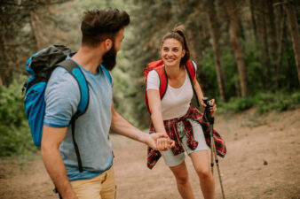 Young couple enjoying hiking in nature