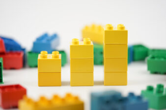 three stacks of building blocks