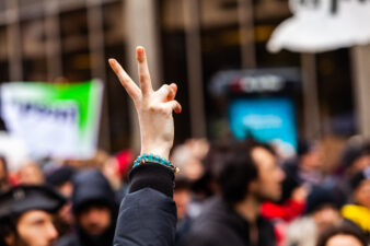 activist holding up peace sign
