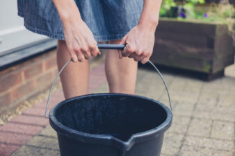 woman holding a bucket