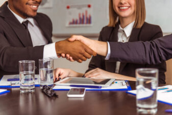 business people shaking hands at a conference