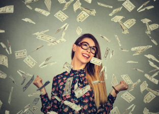 happy woman with cash raining down on her