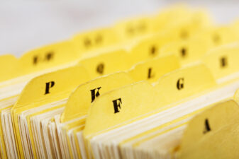 Close up of alphabetical index cards in box