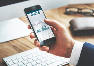 phone holding a goals spreadsheet