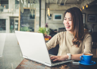 happy woman on laptop