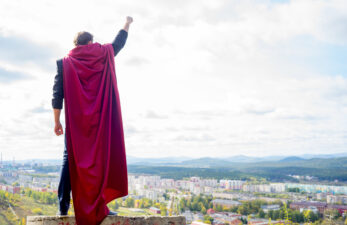 man wearing a superhero cape