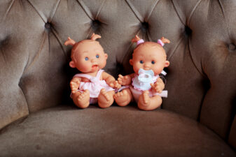 pair of dolls on a couch