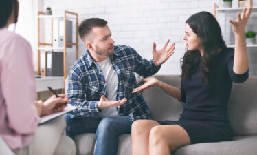 Young couple breaking up at marriage counseling session