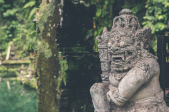 Hindu stone statue in the balinese temple. Tropical island of Bali, Indonesia
